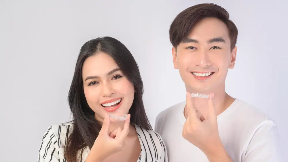Dentist_Scottsdale_AZ_couple_with_invisalign_smiling Dentist_Scottsdale_AZ_couple_with_invisalign_smiling